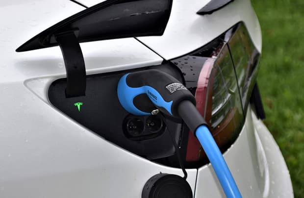 Car pump hanging in side of car