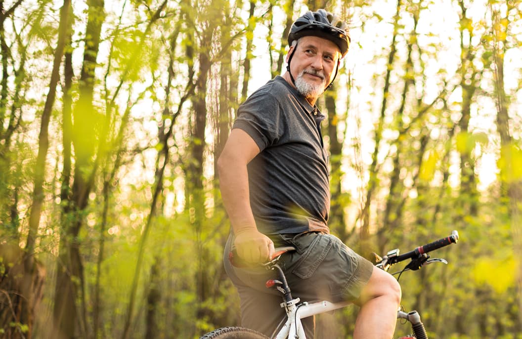 Man cycling in woods